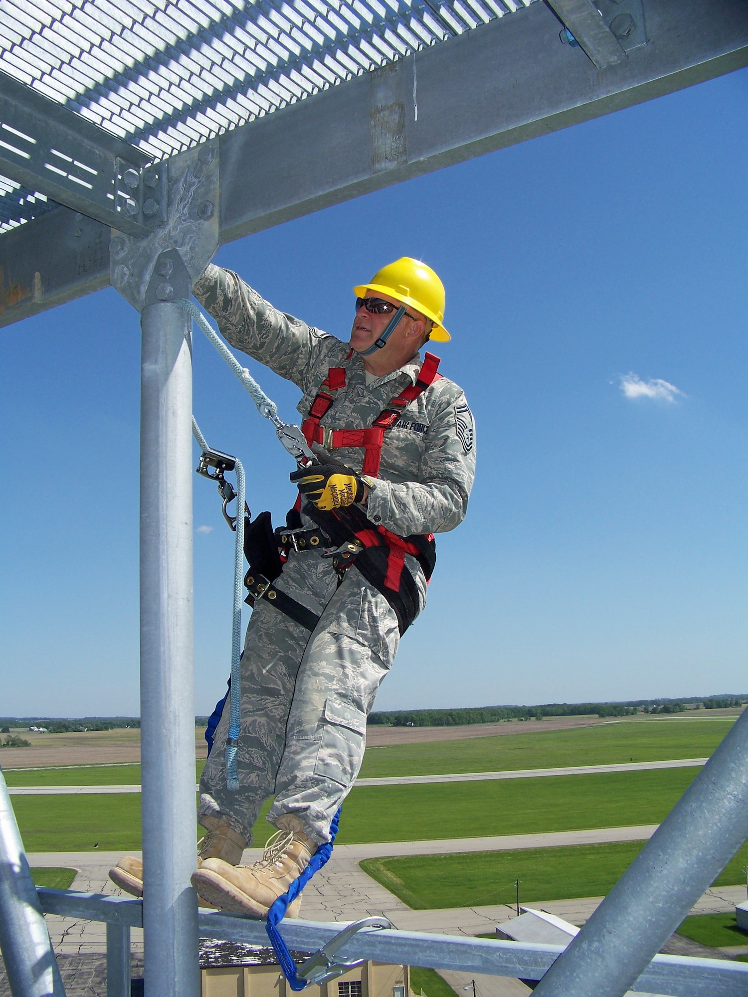 Senior Master Sgt. Michael Pope performs an inspection during construction of a 100' bi-static radar tower May 20, 2011 at Springfield Air National Guard Base, Ohio.  Air National Guard Airmen from six states helped construct four towers and install radars to provide the Air Force Research Laboratory at Wright-Patterson Air Force Base with the capability to conduct advanced sensors research. BRAC 2005 decisions directed relocation of the research radars from Rome, N.Y. Sergeant Pope is with the 219th Engineering Installation Squadron, based in Tulsa, Okla. (U.S. Air Force photo/Rick Shaughnessy)