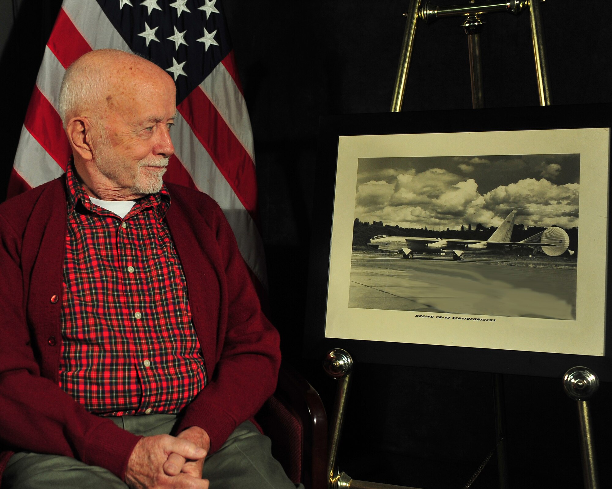 MINOT AIR FORCE BASE, N.D. -- Retired Air Force Master Sgt. and jet engine specialist, Morris A. Walsh, visited Minot Air Force Base May 26, to present base leadership here with an antique photo of a YB-52 Stratofortress aircraft, which he worked on during his time in service during the early 1950s. During his 20-year career in the Air Force, he worked as a jet engine mechanic instructor for air training command, as well as the research and development command on the advancement of new military aircraft. (U.S. Air Force photo/Senior Airman Jesse Lopez)