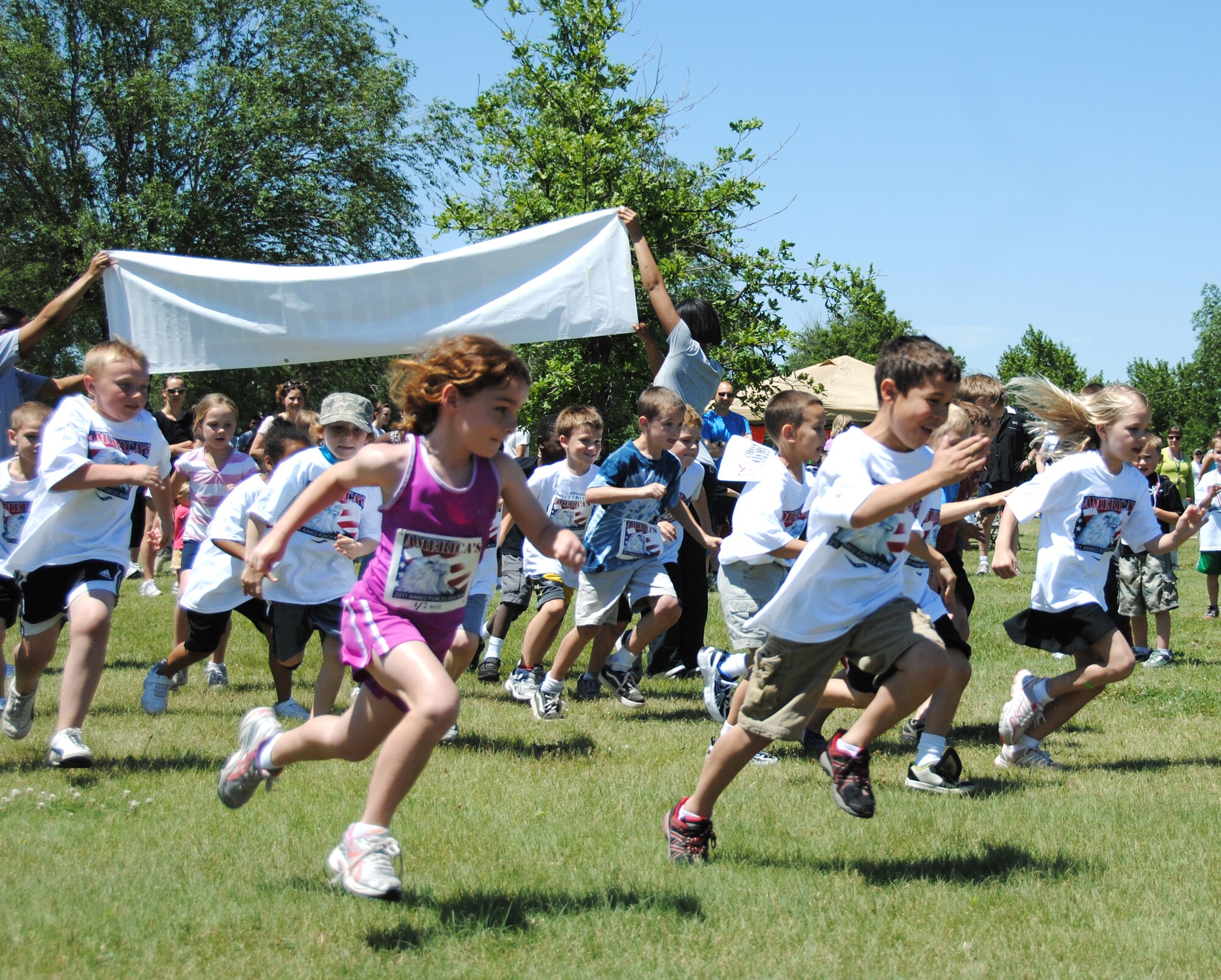 Sixty-seven children of Team Vance members run in the 2011 Armed Forces Kids Run held during the Hello Summer, Goodbye CI party May 27 at the Base Park. More than 280 civilian and military runners and walkers participated in the Run-to-Summer 5K run/1-mile walk held at the same time. (U.S. Air Force photo/ Zach Sproul)