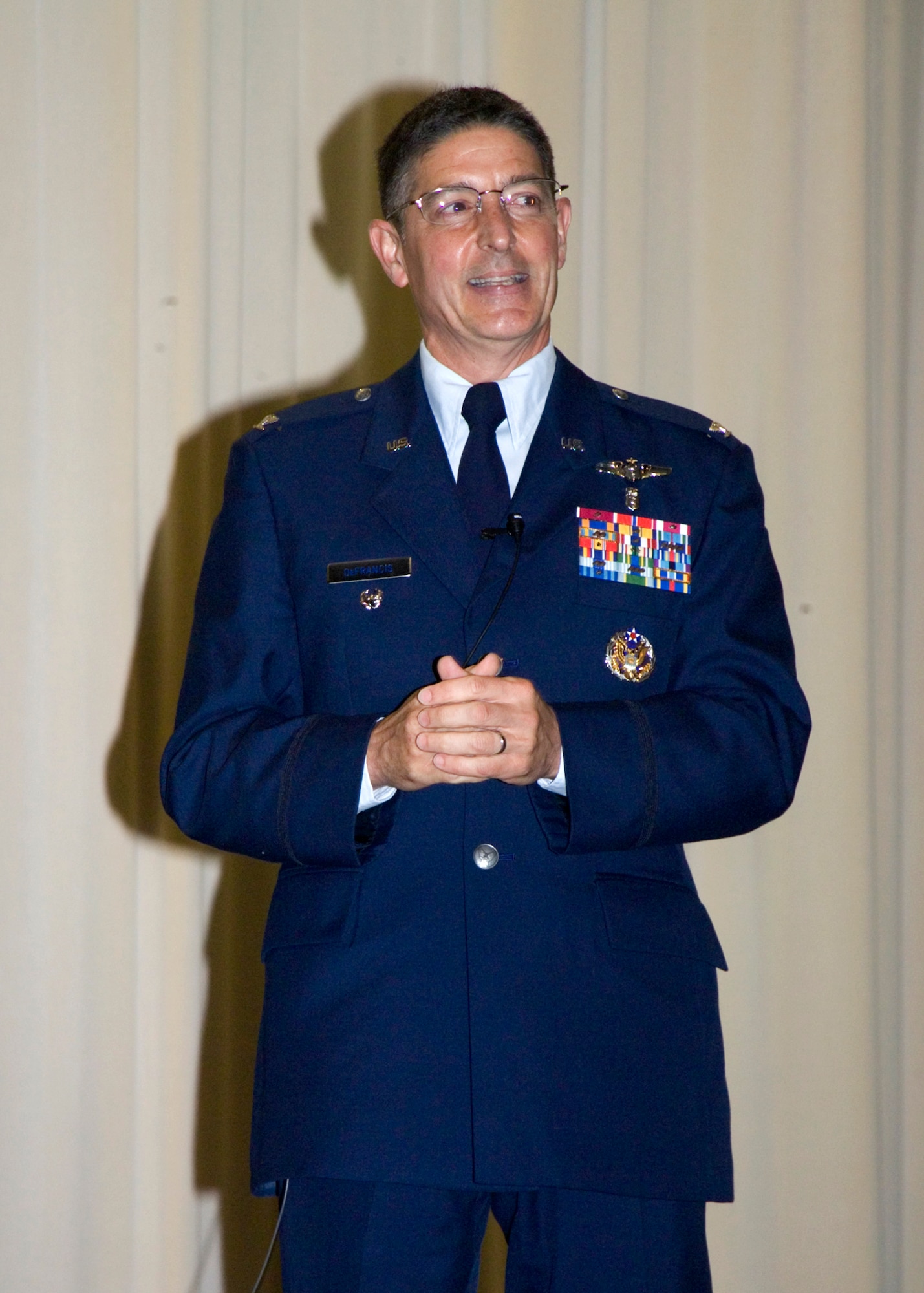 Col. Dominic DeFrancis speaks during the graduation ceremony for Wright-Patterson Medical Center medical and dental education residents held May 26, 2011 at the National Museum of the U.S. Air Force.  The officers will now be assigned to Air Force bases around the world to provide medical care for Airmen, joint warfighters, military retirees and eligible family members. Colonel DeFrancis is Medical Corps director, Office of the Air Force Surgeon General. (U.S. Air Force photo/Mark Pugel) 