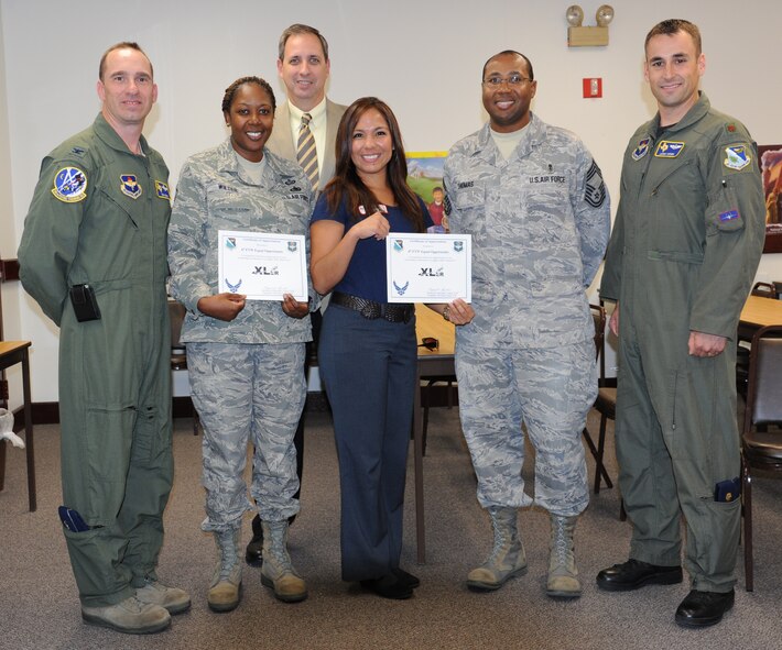 LAUGHLIN AIR FORCE BASE, Texas – Members of the 47th Flying Training Wing Equal Opportunity office pose with members of Laughlin’s leadership, including Col. Thomas Murphy, 47th FTW vice commander, after being presented the XLer of the Week award here May 25. The XLer is a weekly award chosen by wing leadership and given to those who consistently make outstanding contributions to Laughlin and their unit. (U.S. Air Force photo by Airman 1st Class Blake Mize)