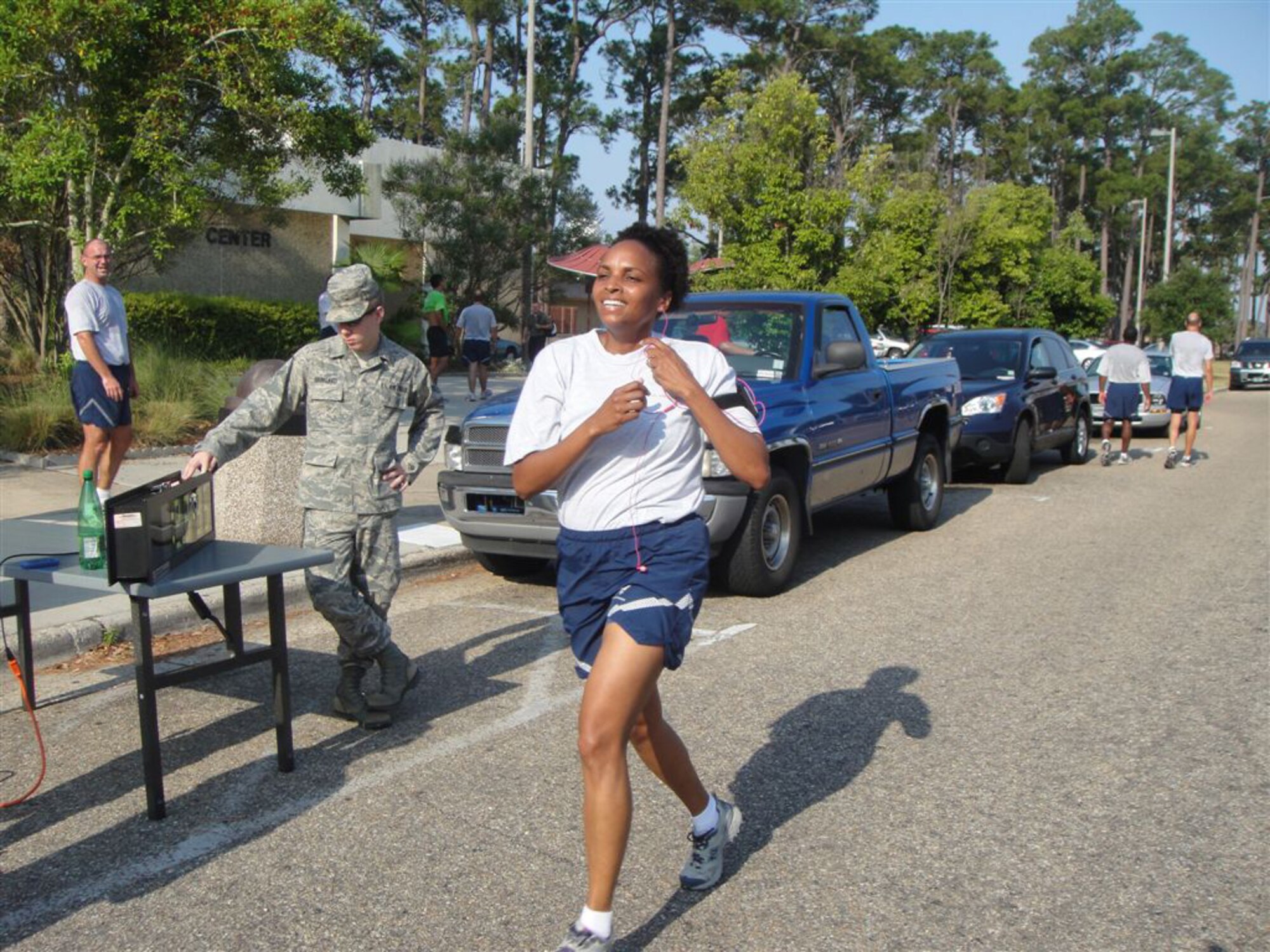 Monita McCowan, 81st Force Support Squadron, is the first woman finisher during the “Don’t Fry Day 5K” sponsored May 20 by the 81st Medical Operations Squadron dermatology clinic. Geoffrey Sasaki, 81st Diagnostics and Therapeutics Squadron,
was the first to cross the finish line. Almost 30 runners participated in the event that promoted sun safety awareness.  (U.S. Air Force photo by Maj.WendiWohltmann)