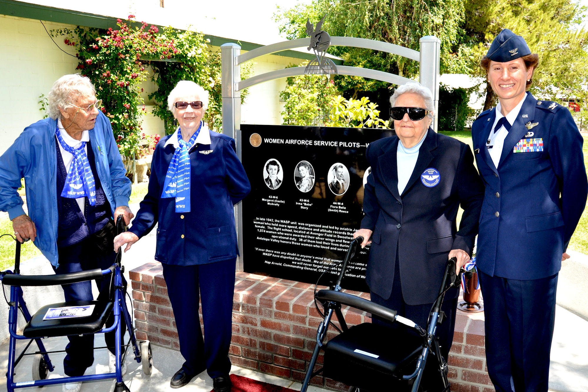 Women Airforce Service Pilots Jan Wood, Irma "Babe" Story and Flora Belle Reece pose in front of a monument dedicated to them and other WASPs on Memorial Day with Col. Dawn M. Dunlop, 412th Test Wing Commander. Thirty-eight WASPs gave their lives during World War II but did not receive military honors as they were considered civilians. On July 1, 2009, President Obama awarded the WASPs the Congressional Gold Medal for their service during WWII.