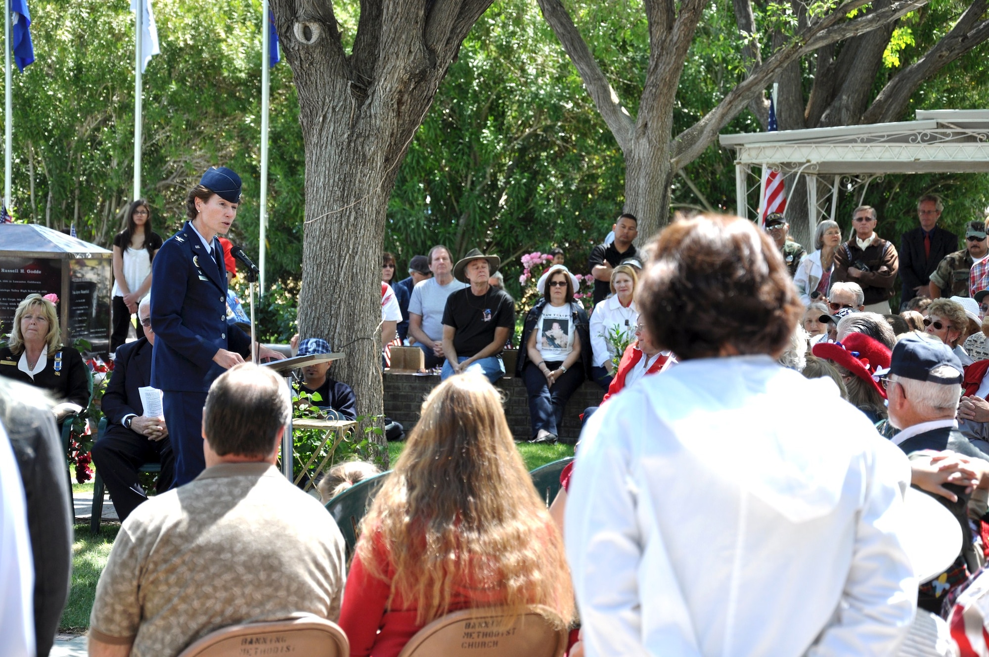 Col. Dawn M. Dunlop, 412th Test Wing Commander, addresses attendees at the Lancaster Cemetery Veterans Court of Honor May 30. Colonel Dunlop was keynote speaker during a Memorial Day ceremony that honored Women Airforce Service Pilots from World War II. Directly behind Colonel Dunlop stands Valeria Ugalde of Hillside Middle School. (Air Force photos by Mike Strickler)