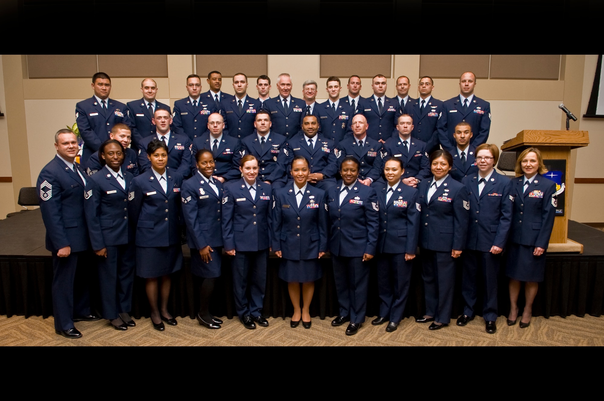 BUCKLEY AIR FORCE BASE, Colo. -- More than 30 of Team Buckley's 80 Community College of the Air Force graduates pose for a group photo May 26, 2011. Joining them is CCAF Vice Commandant Chief Master Sgt. James Pepin, bottom left, who served as guest speaker for the graduation. (U.S. Air Force graphic by Staff Sgt. Kathrine McDowell) 