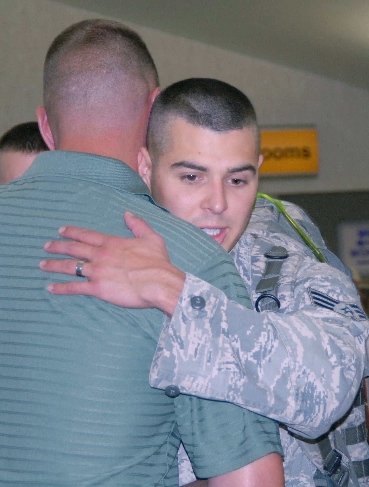 SAN ANGELO, Texas -- Senior Airman Alexander Brill, 17th SFS, bids farewell to Maj.  James Masoner, 17th SFS Commander, at the San Angelo Regional Airport.  Airman Brill deployed with fellow security forces members to Iraq Sunday. (U.S. Air Force photo/Kent Cummins)