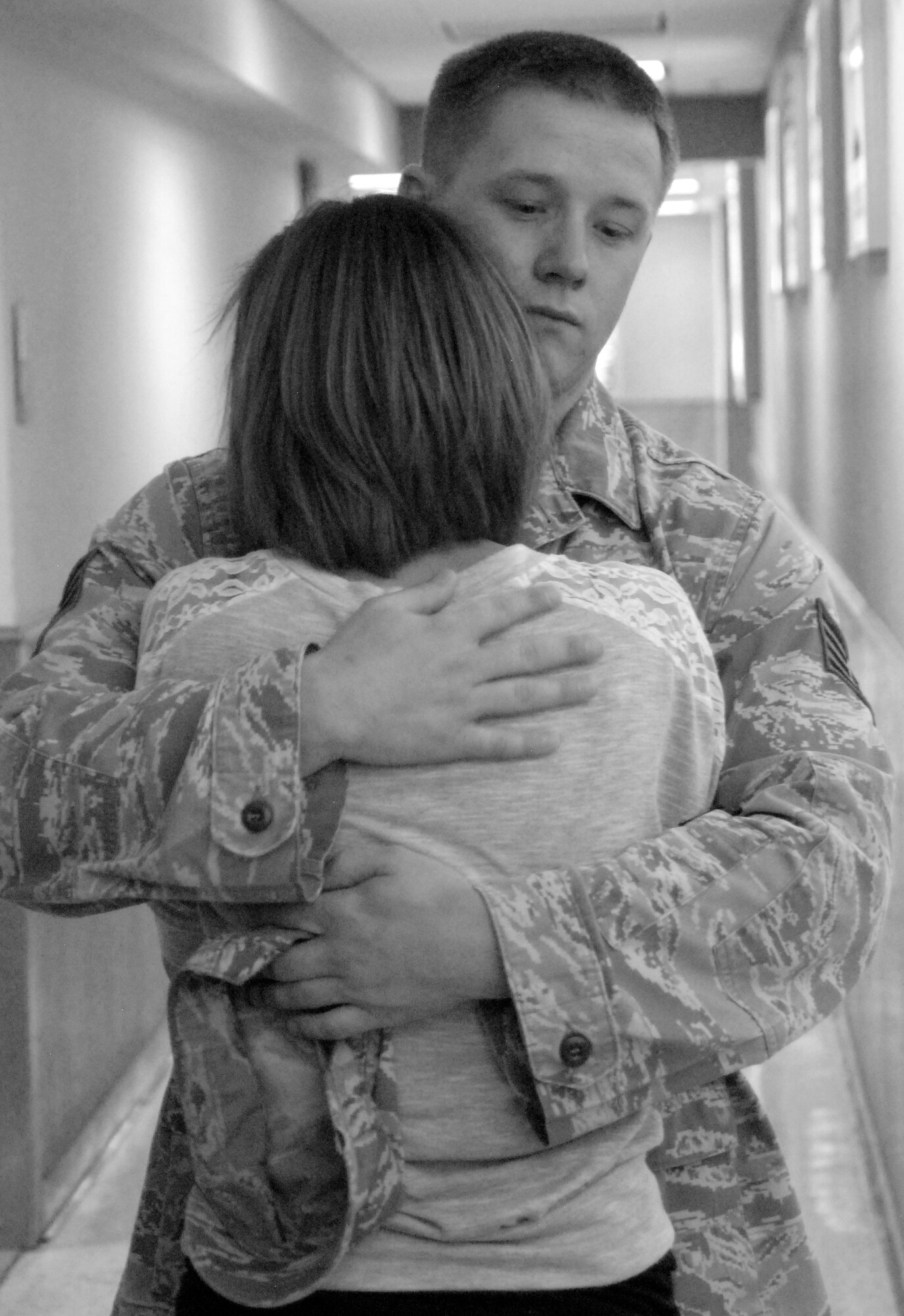 SAN ANGELO, Texas -- Staff Sgt. Jeremy Smith, 17th Security Forces Squadron, hugs a friend at the San Angelo Regional Airport Sunday before departing for Iraq.  (U.S. Air Force photo/Kent Cummins)