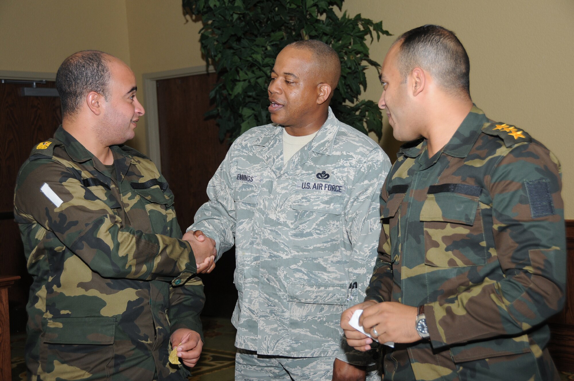 Chief Master Sgt. Curtis Jennings, 81st Training Wing command chief, spends some time chatting with Egyptian Army’s Major Ahmed Elshafey, left, and Capt. Mahmoud Elraei, right, at the international student mixer at the Bay Breeze Event Center, May 16.  (U.S. Air Force photo by Kemberly Groue)
