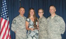 From left to right: Chief Master Sgt. Jeff Jarvis, RED HORSE Manager, Ms. Emily Bruckner, Lt. Co.l Cheryl Pavic, RHS deputy commander and Capt.Chris Woofter, RHS deputy operations flight commander pose at the AFRC Civil Engineer/RED HORSE Commander's Conference in May. Ms. Bruckner won a civilian award. (USAF photo courtesy of 567RHS)