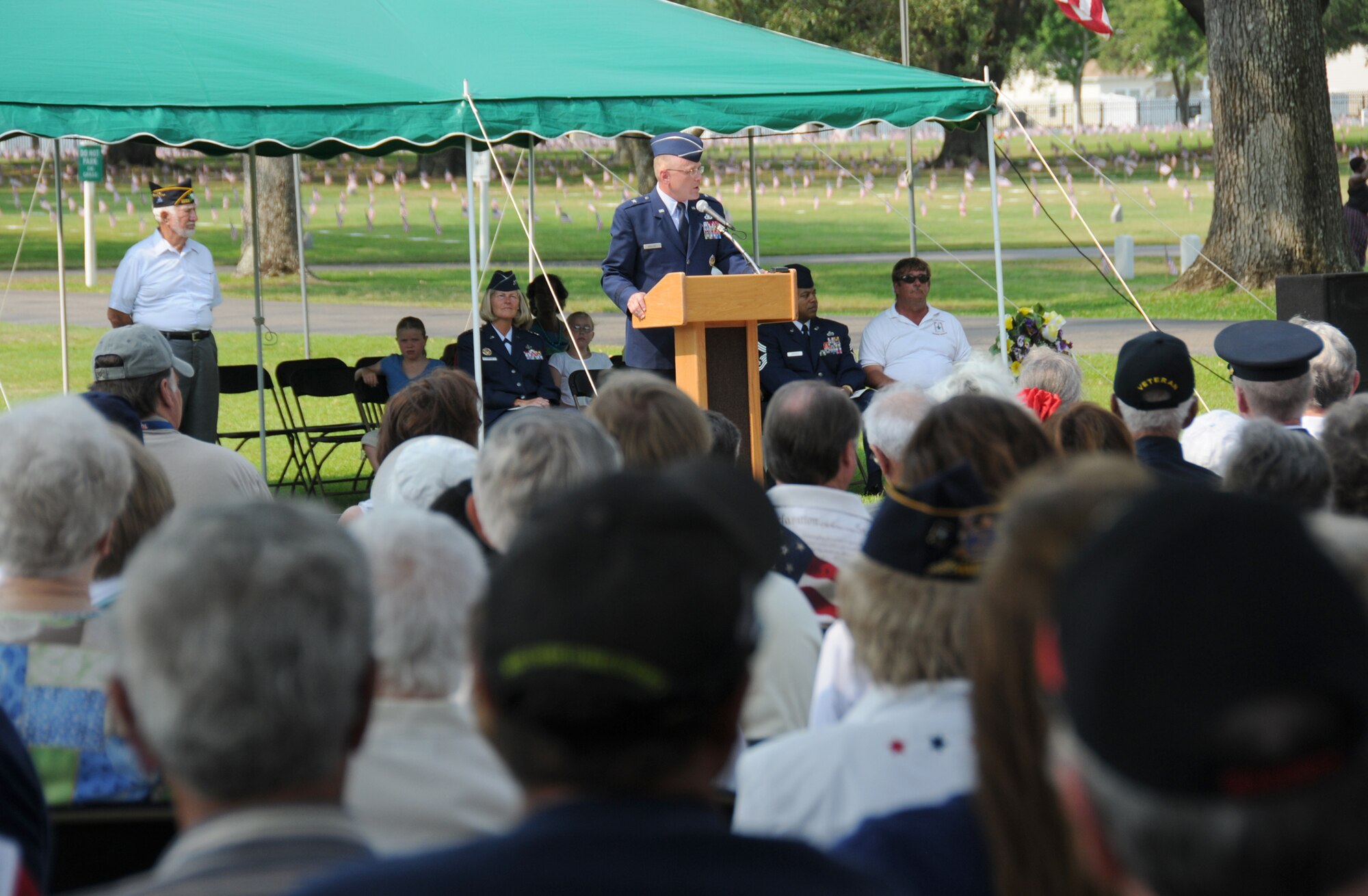 Brig. Gen. Andrew Mueller, center, 81st TrainingWing commander, speaks at Monday’s Memorial Day observance at the Biloxi National Cemetery. He’s flanked by Maj. Gen. Mary Kay Hertog, left, 2nd Air Force commander, and Chief Master Sgt. Curtis Jennings, right, 81st TRW acting command chief.  (U.S. Air Force photo by Kemberly Groue)