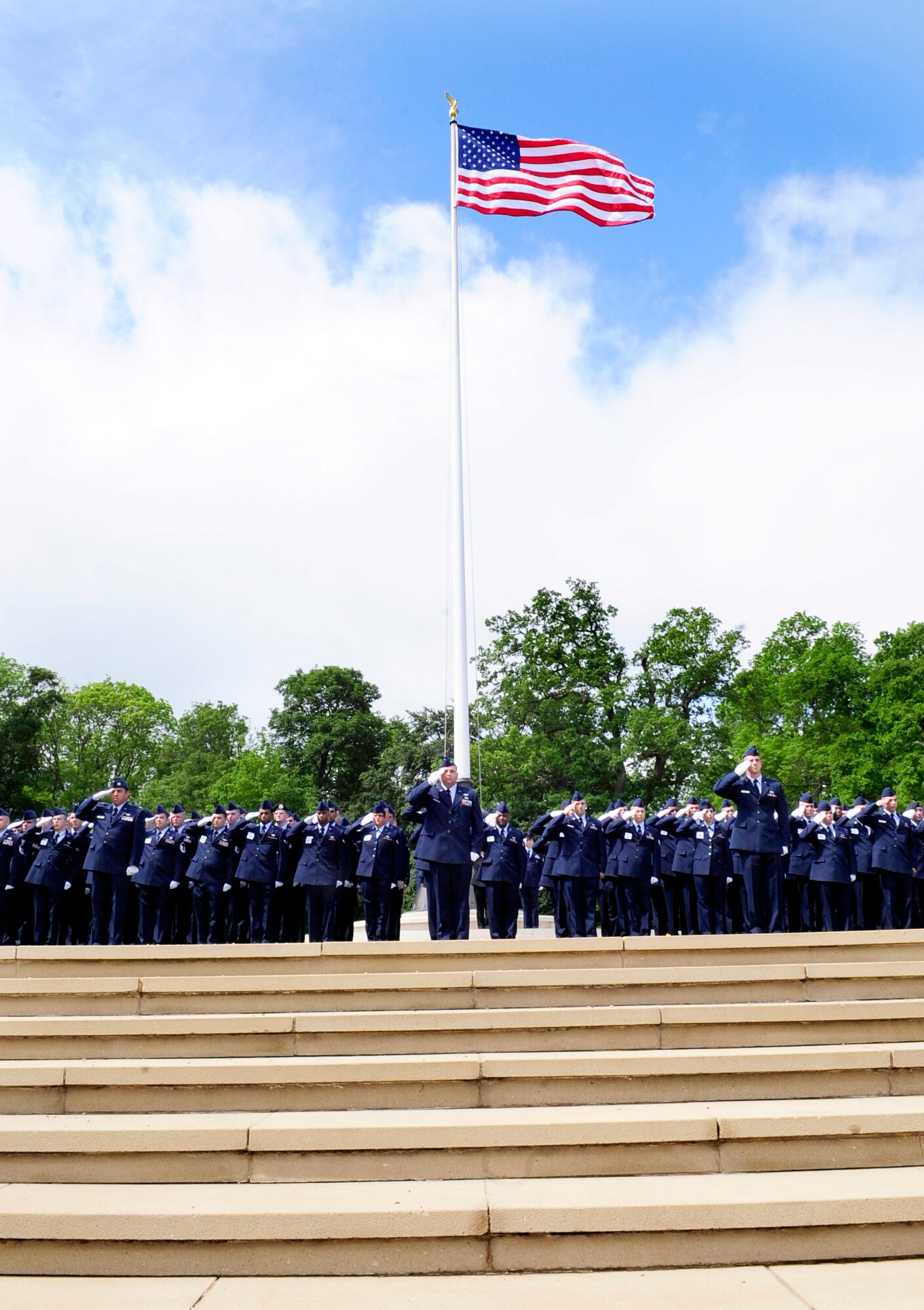 Cambridge, England -- Airmen from RAFs Mildenhall and Lakenheath stand in formation during the Madingley American Cemetery Memorial Service in Cambridge May 30, 2011. There were 170 Airmen who volunteered for the service from both bases in remembrance of the fallen. (U.S. Air Force photo/Senior Airman Ethan Morgan)