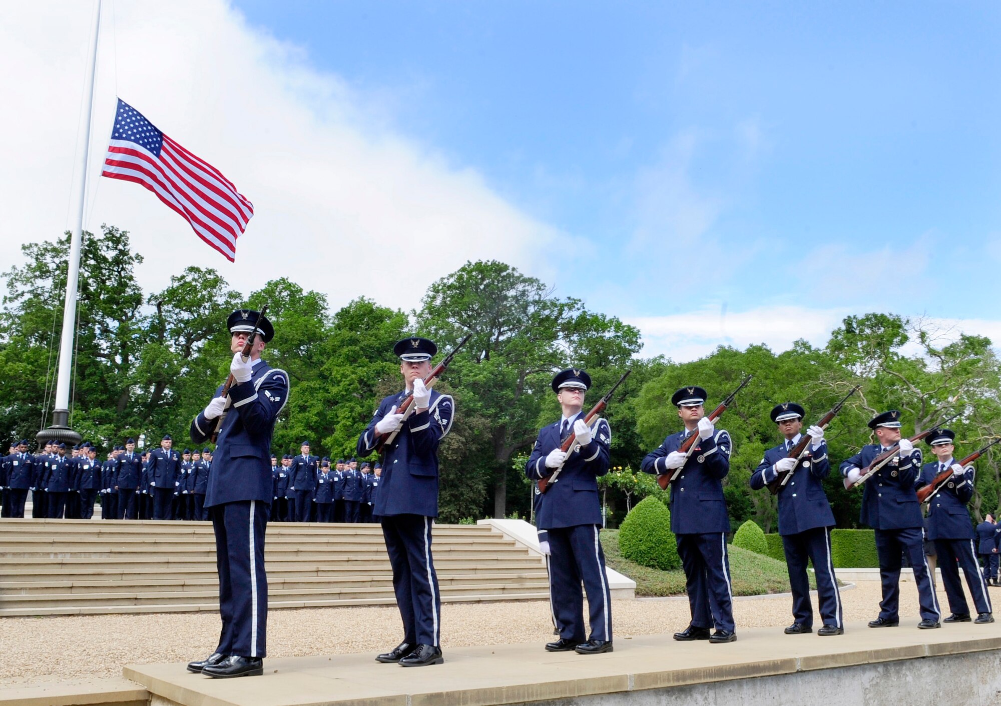 Cambridge, England -- The RAF Mildenhall Honor Guard performs a three-volley salute during the Madingley American Cemetery Memorial Service in Cambridge May 30, 2011. The salute is also performed at military funerals and originates from the European dynastic wars when the battle was ceased so the dead and wounded could be removed, and three shots were fired to signal that battle could resume. (U.S. Air Force photo/Senior Airman Ethan Morgan)