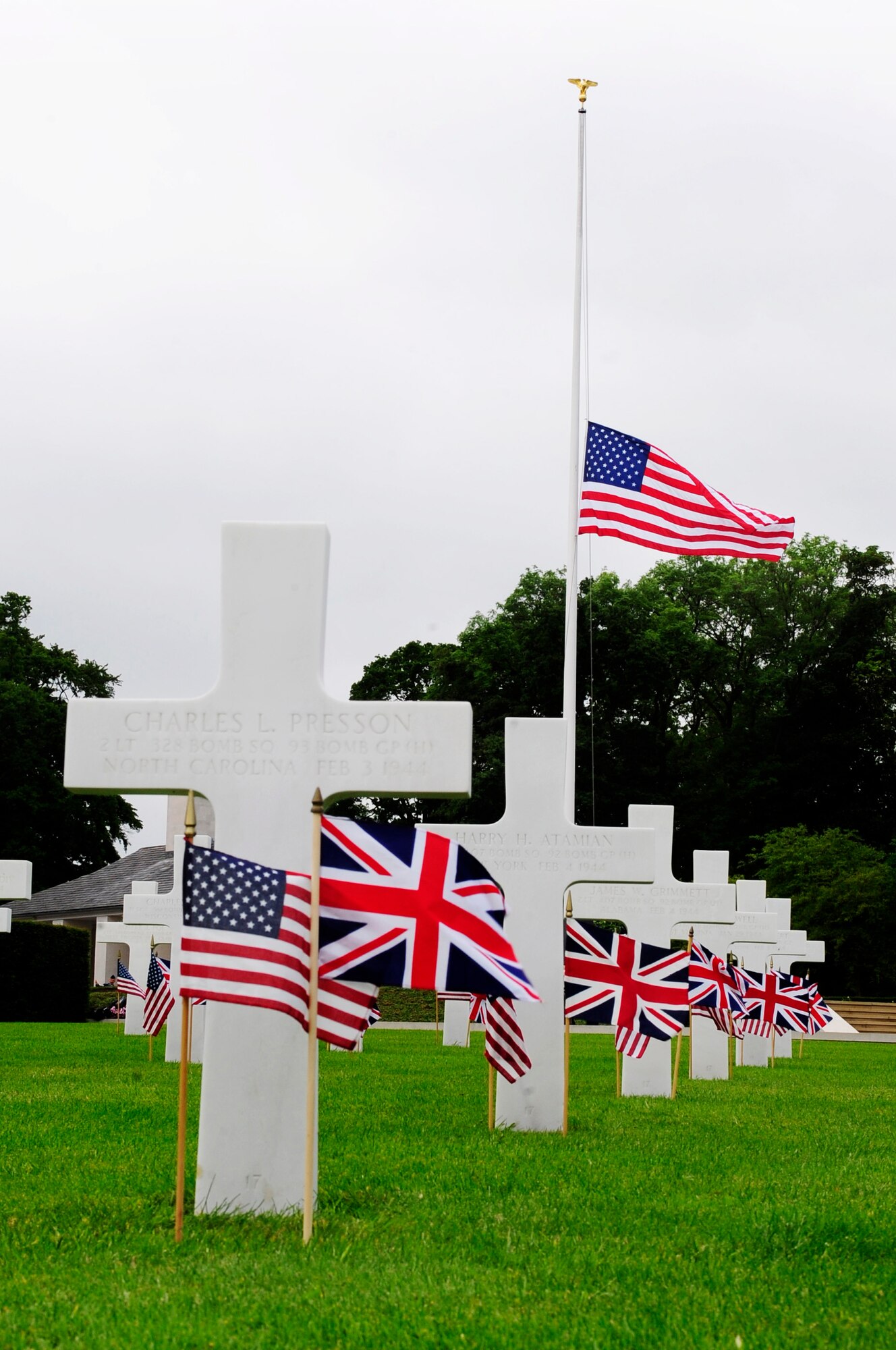 Cambridge, England -- The U.S. flag is flown at half staff during the Madingley American Cemetery Memorial Service in Cambridge May 30, 2011. The service was held by RAF Mildenhall annually in remembrance of those who gave their lives to achieve victory in Europe against the Axis powers. (U.S. Air Force photo/Senior Airman Ethan Morgan)