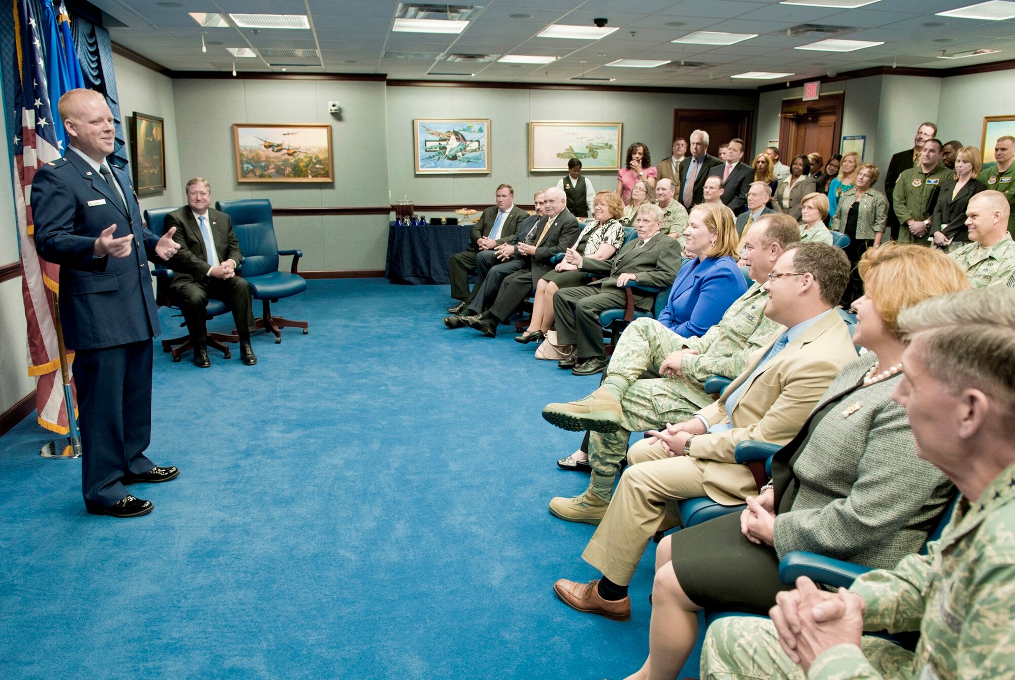 Secretary of the Air Force Michael Donley (seated second from left) looks on as Maj. Paul Sebold gives remarks after receiving the Air Force International Affairs Excellence Award for 2010 during a ceremony May 31, 2011, in the Pentagon. Established in 2008, the annual award recognizes the Air Force member who is judged to most effectively build, sustain, expand and guide enduring international relationships. Major Sebold is assigned to Headquarters U.S. Air Forces in Europe at Ramstein Air Base, Germany, as a political
military affairs strategist and country desk officer. (U.S. Air Force photo/Jim Varhegyi)
