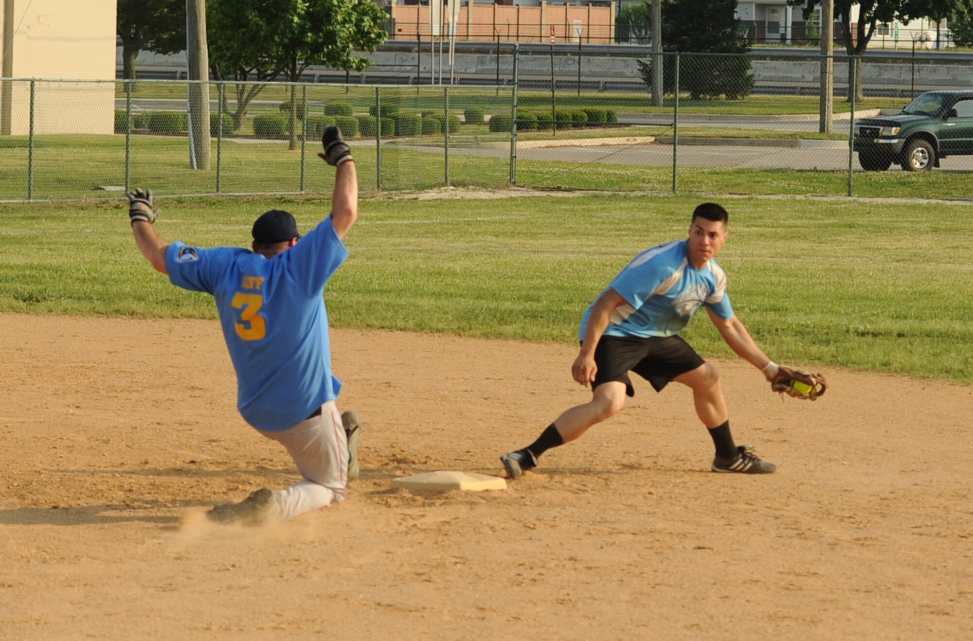 Joseph Perez, 436th Maintenance Squadron shortstop, forces out Allen Diffenbaugh, 9th Airlift Squadron coach, at second plate during an intramural softball game against the 9th Airlift Squadron.  436 MXS A defeated 9 AS with a final score of 19 – 9.  (U.S. Air Force photo by Staff Sgt. Chad Padgett)