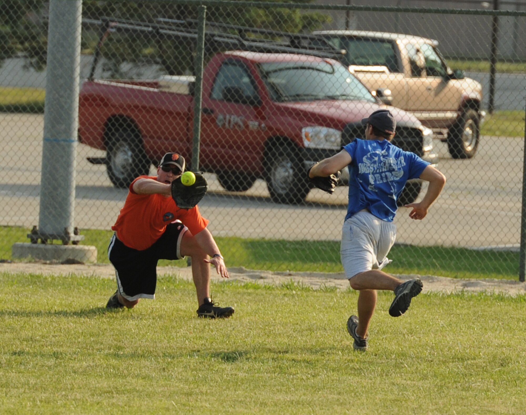 Todd Early, 9th AS center left fielder, makes a diving catch against the 436th Maintenance Squadron during the first softball game of the season May 31, 2011.  9 AS lost to 436 MXS A with a final score of 19 – 9.  (U.S. Air Force photo by Staff Sgt. Chad Padgett)