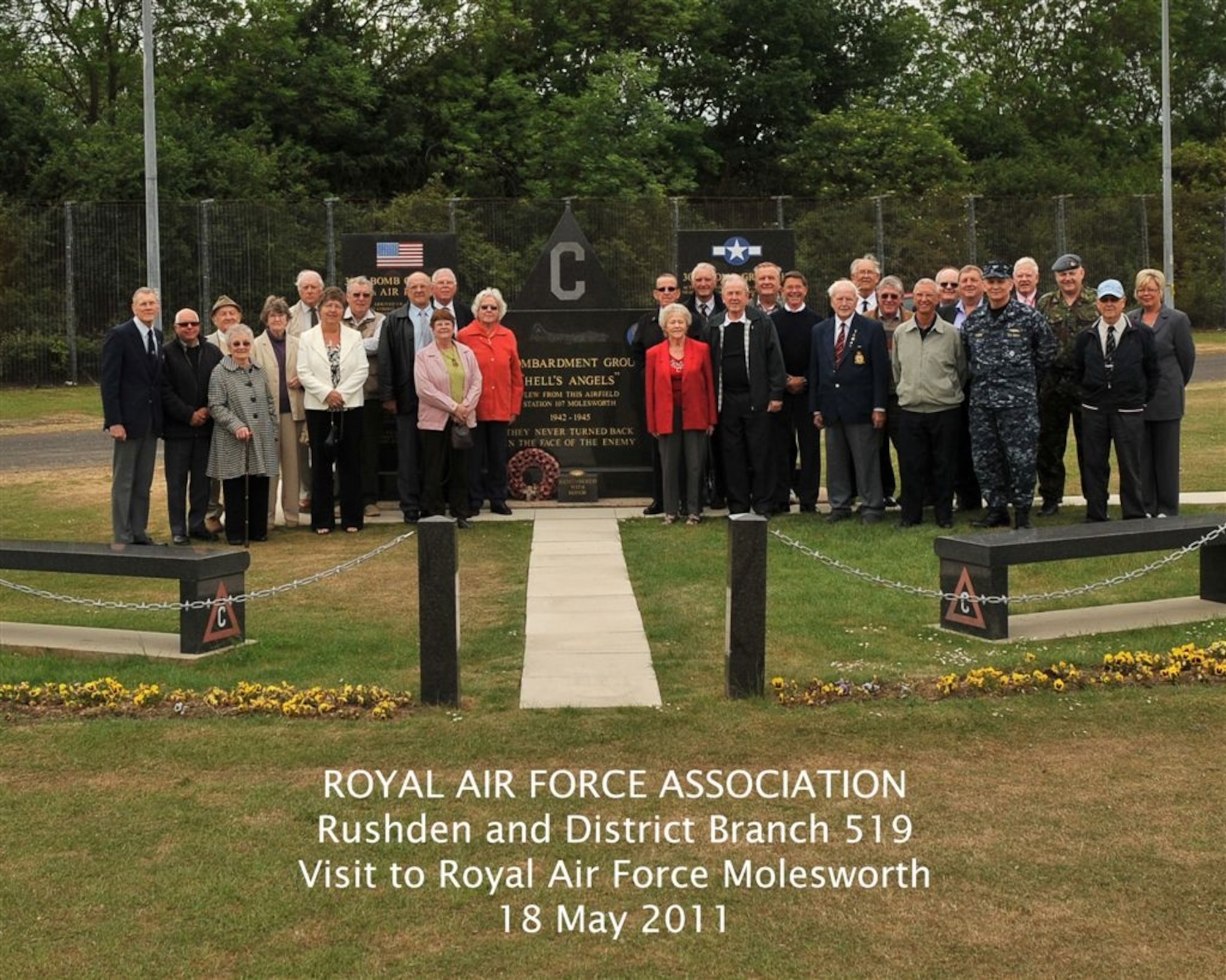 Royal Air Force Association Rushden and District members gather in front of the 303rd Bomb Group (Heavy) memorial during their May 18th visit to RAF Molesworth (U.S. Air Force photo by Staff Sgt. Javier Cruz)