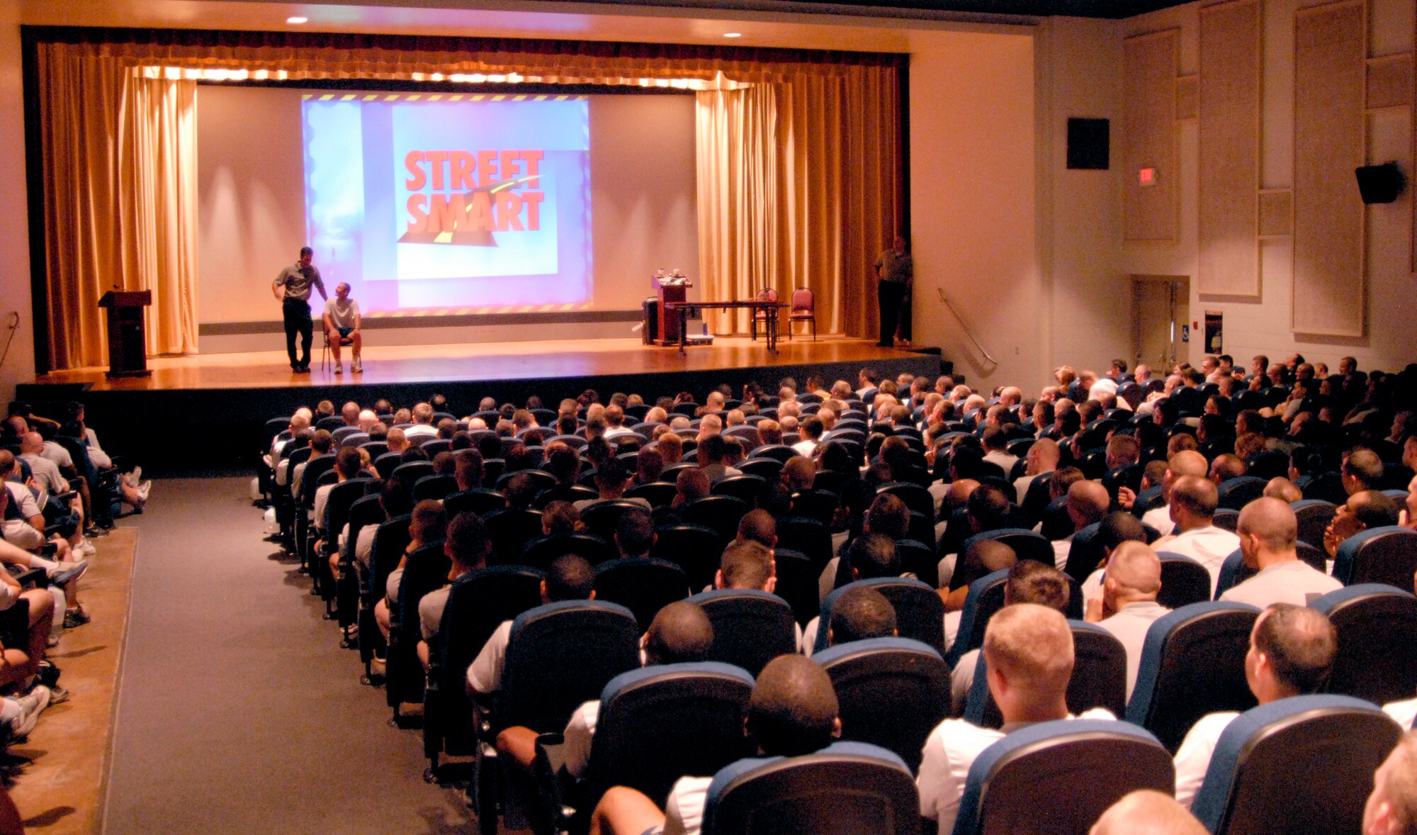 GOODFELLOW AIR FORCE BASE, Texas -Servicemembers fill the base theater to listen to the Street Smart presentation during Safety Day activities, May 27. Street Smart is a presentation designed to take viewers into the experience of saving the life of someone who has suffered severe trauma from a car crash. (U.S. Air Force photo/Tech. Sgt. Jon DuMond)

