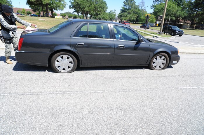 Last month an individual driving onto Joint Base Charleston was instructed to return to the Visitor's Center to obtain a pass. The driver
disobeyed the instructions of Security Forces personnel and attempted to enter the base. As a result, the Cat Claw tire shredders were deployed and immobilized
the vehicle. Security Forces personnel are on-duty for your protection and safety. While on Joint Base Charleston,, remember, please follow all Security Forces instructions. 