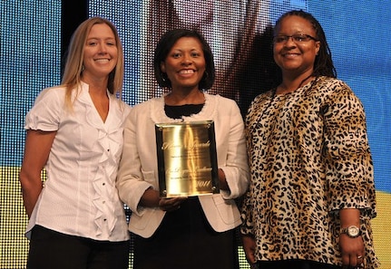 Shannon Norris, Joint Base Charleston – Air Base Youth Programs director (left) and Paula Matthews, JB CHS – AB School Age Program Coordinator (right) accept the Honor Award for Overall Program Excellence from April Hawkins, MetLife Foundation Civic Affairs Program director during the Boys & Girls Clubs of America’s 105th national conference held recently in New Orleans, La. (courtesy photo)