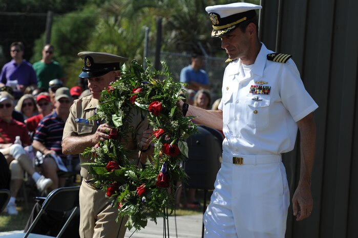 Navy Capt. Ralph Ward and Sid Busch prepare to lay a wreath at the Patriots Point Naval & Maritime Museum's Vietnam Support Base exhibit at Patriots Point, Mt. Pleasant, S.C., May 30. Captain Ward was the keynote speaker during the ceremony. He is the Joint Base Charleston deputy commander. Mr. Busch is a retired Navy Senior Chief petty officer. (U.S. Air Force photo/ Staff Sgt. Nicole Mickle)  