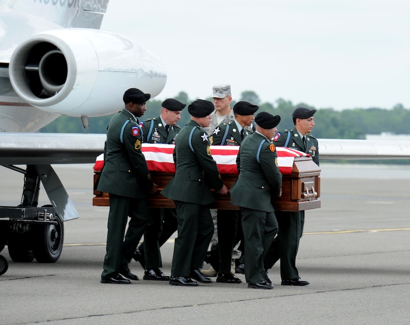 Members of the 187th Ordnance Battalion from Fort Jackson, S.C., remove Army PFC Cheziray Pressley's casket from a private jet on the Joint Base Charleston flightline, May 27. Private Pressley was assigned to the Brigade Troops Battalion, 1st Stryker Brigade Combat Team, 25th Infantry Division from Fort Wainwright, Alaska. He and three other service members were killed in Afghanistan when a roadside bomb exploded. Private Pressley graduated from Fort Dorchester High School in North Charleston, S.C. More than 600 people attended his memorial service at the North Charleston Convention Center on Memorial Day. He is survived by his wife Dewn, step daughter Leila, and parents Raymond and Jirlie.  (U.S. Air Force photo/ Staff Sgt. Nicole Mickle) 