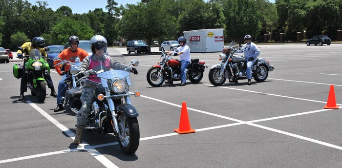 Joint Base Charleston motorcycle riders, participating in a Motorcycle Safety Event, wait their turn to perform the ‘stop on a dime’ maneuver May 26, at Joint Base Charleston - Air Base. More than 20 motorcycle riders took part in the event which was designed to  improve the skills of the riders and bring awareness to the Air Force’s 2011 Year of Motorcycle Safety. U.S. Air Force photo/ A1C Jared Trimarchi
