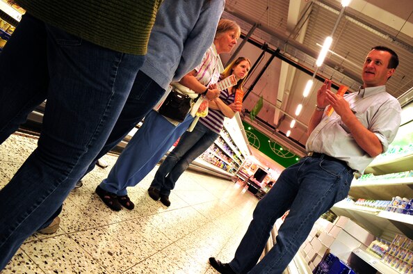 Hagan Volke, cultural adaptation liaison officer with the Ramstein, AB Airman & Family Readiness Center explains shopping on the local economy to members of the first What is What class at a local supermarket, May 26, 2011, Kaiserslautern, Germany. The program was designed to give hands on experience to members of the Department of Defense in shopping on the local economy. (U.S. Air Force Photo by. Tech. Sgt. Jocelyn L. Rich)