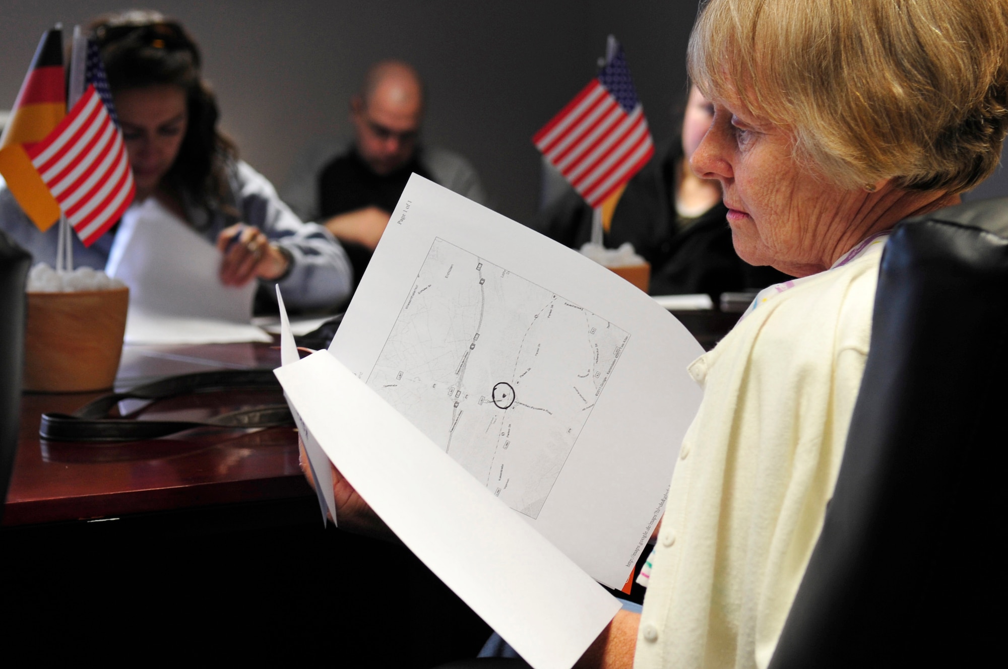 Judy Brangwin, wife of Bob Cates, a contractor at Kleber Kaserne, Germany, reads through a pamphlet of information handed out at the first official What is What class at the Airman & Family Readiness Center, May 26, 2011, Ramstein AB, Germany. The program was designed to give hands on experience to members of the Department of Defense in shopping on the local economy. (U.S. Air Force Photo by. Tech. Sgt. Jocelyn L. Rich)