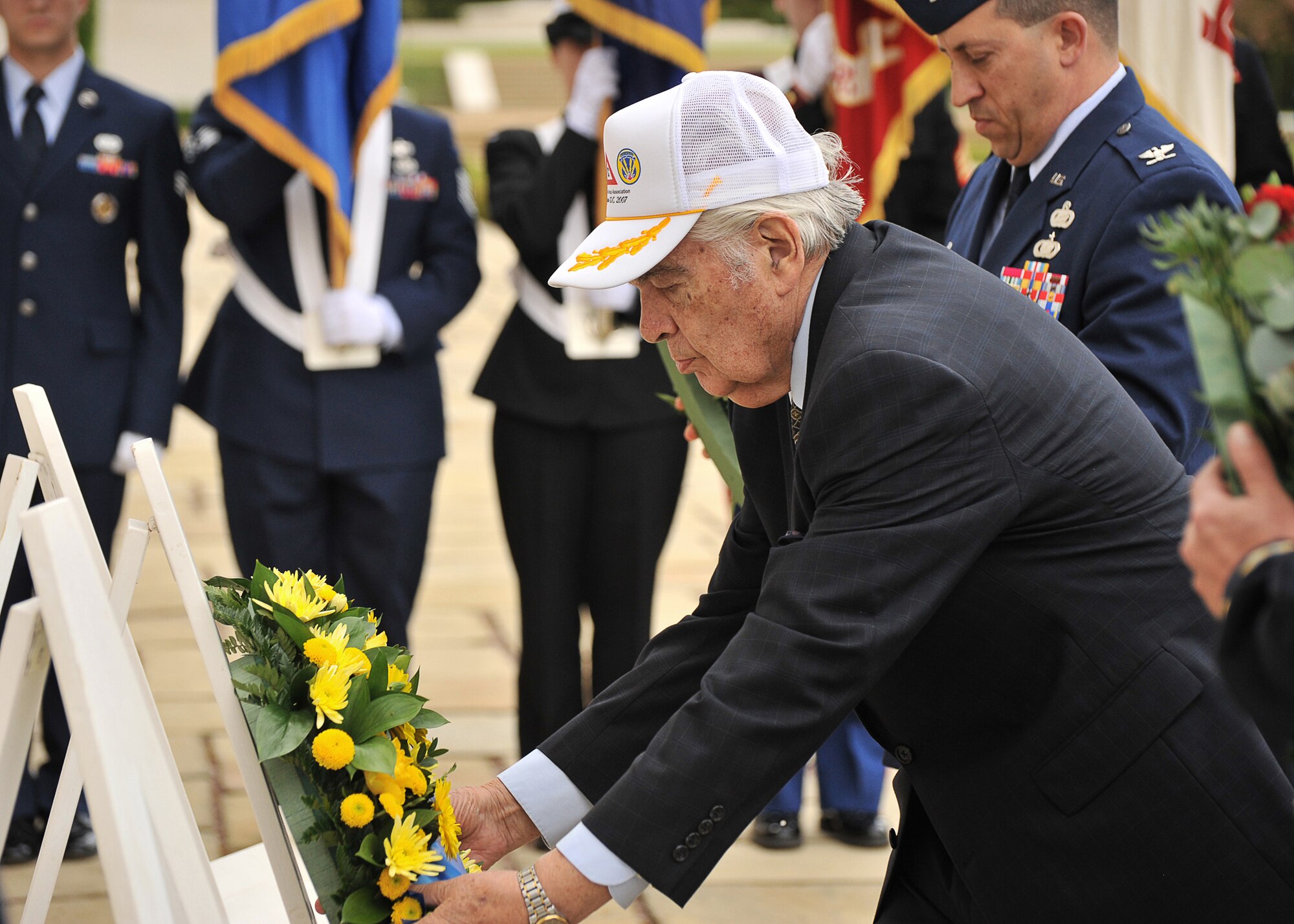 Former 360th Bomb Squadron Radioman Eddie Deerfield lays a wreath on behalf of the 303rd Bomb Group (Heavy) during a May 13th ceremony at Cambridge American Cemetery in England as part of HELL’S ANGELS DAY celebrating the 68th anniversary of the completion of 25 missions by that B-17F.  (U.S. Air Force photo by Staff Sgt. Javier Cruz)