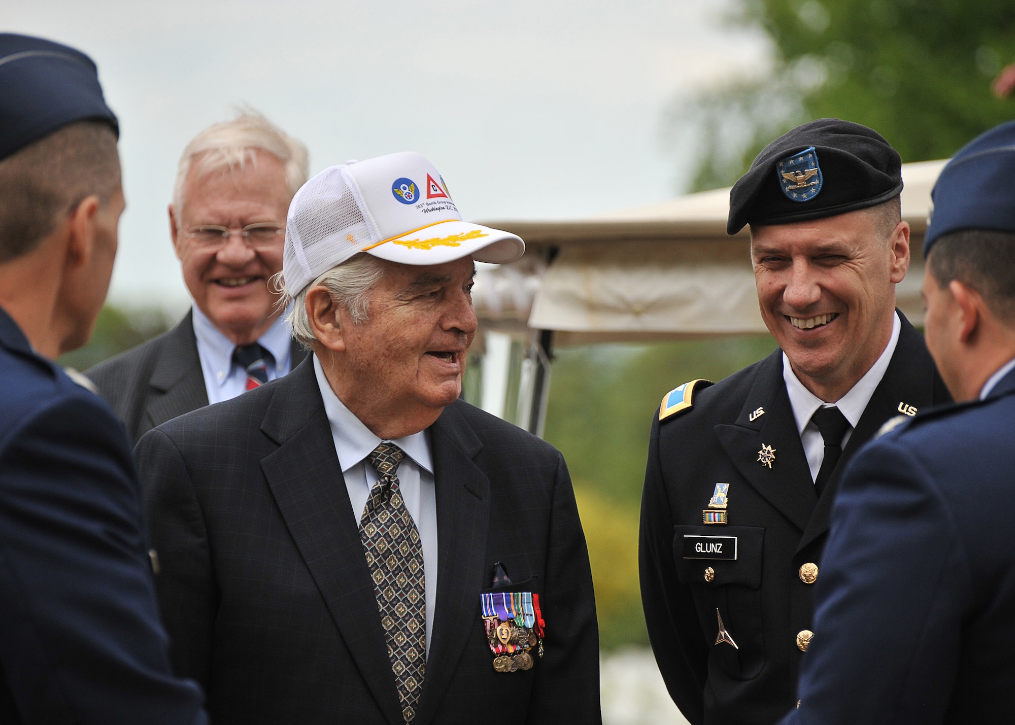 303rd Bomb Group veteran Eddie Deerfield shares a light moment with JAC Commander Army Colonel Matt Glunz, as JAC Historian Peter Park looks on during the May 13th HELL’S ANGELS DAY celebration (U.S. Air Force photo by Staff Sgt. Javier Cruz)