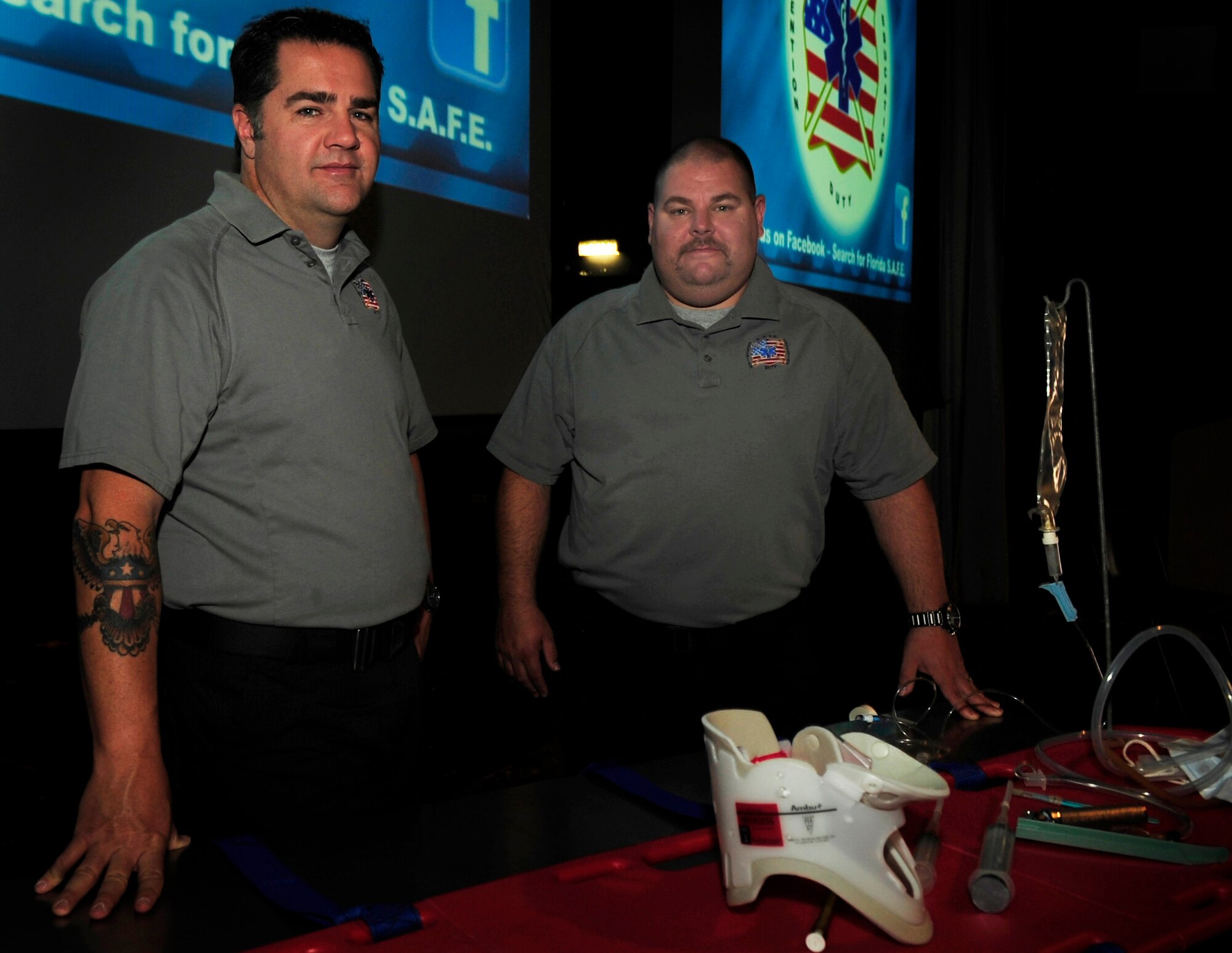 Joe McCluan and Scott McIntyre, firemen and paramedics with the Orlando Fire Department pose for a photo before delivering a safety briefing for Airmen and DOD members of the Kaiserslautern Military community, May 27, 2011, Ramstein AB, Germany. The Street Smart presentation is a straight forward safety demonstration on the consequences of poor choices and driving through Florida Stay Alive from Education (S.A.F.E.). (U.S. Air Force Photo by Tech. Sgt. Jocelyn L. Rich)