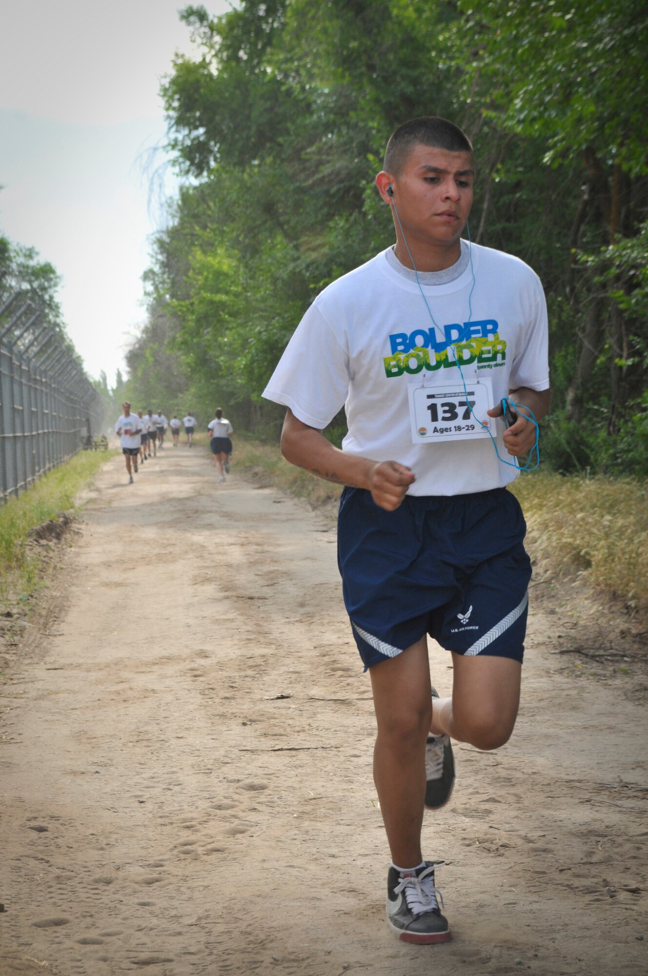 TRANSIT CENTER AT MANAS, Kyrgyzstan - Service members deployed here run in the annual Bolder Boulder 10K race May 30.  The race here shadows the largest race in the U.S., which is held annually in Boulder, Colo.  Service members have their individual times displayed during the actual race in Boulder. (U.S. Air Force photo/Staff Sgt. Stacy Moless)
