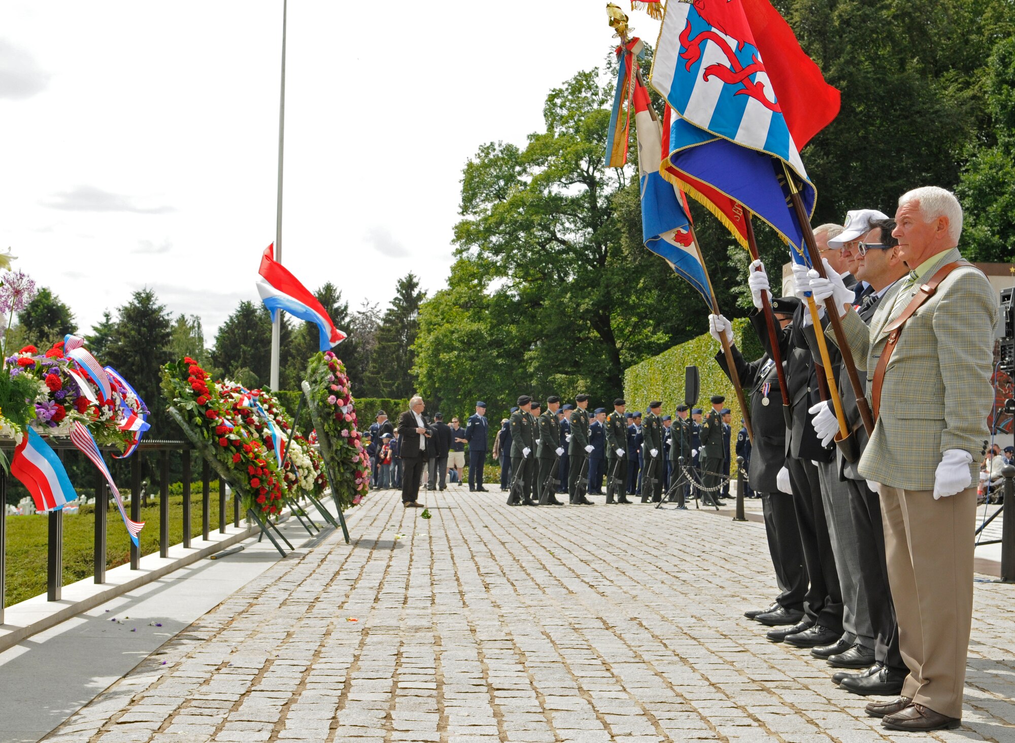 A flag detail stands at attention during a Memorial Day service at the Luxembourg American Cemetery and Memorial in Luxembourg May 28. The cemetery and memorial is the final resting place for more than 5,000 U.S. service members, including Gen. George S. Patton. (U.S. Air Force photo/Staff Sgt. Benjamin Wilson)