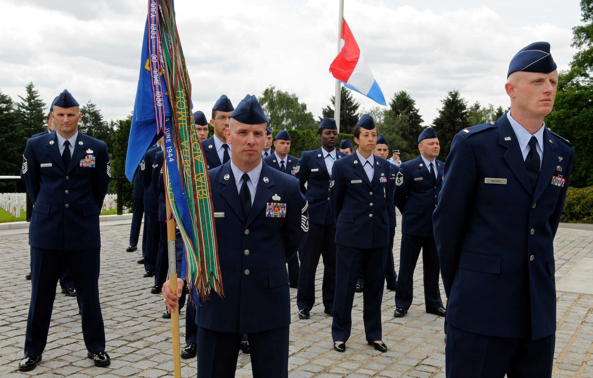 LUXEMBOURG – A formation of Airmen from the 52nd Fighter Wing stand at parade rest before the beginning of a Memorial Day service at the Luxembourg American Cemetery and Memorial in Luxembourg May 28. The cemetery and memorial is the final resting place for more than 5,000 U.S. service members, including Gen. George S. Patton. (U.S. Air Force photo/Staff Sgt. Benjamin Wilson)