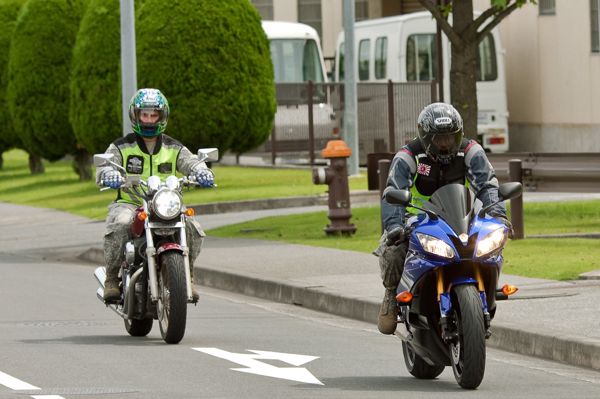 YOKOTA AIR BASE, Japan -- Tech. Sgt. Jason Scott, flight safety noncommissioned officer (left), and Tech. Sgt. Scott Roberts, ground safety craftsman, both from the 374th Airlift Wing Safety office, take all necessary safety measures while driving their motorcycles at Yokota Air Base, Japan, May 31, 2011. During the Critical Days of Summer campaign, base leadership urge all Airmen to exercise safe practices and make sound judgments both on and off-duty. (U.S. Air Force photo/Osakabe Yasuo)