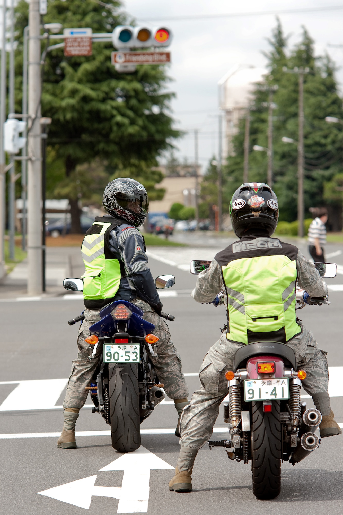 YOKOTA AIR BASE, Japan -- Tech. Sgt. Scott Roberts, flight safety noncommissioned officer (left), and Tech. Sgt. Jason Scott, ground safety craftsman, both from the 374th Airlift Wing Safety office, take all necessary safety measures while driving their motorcycles at Yokota Air Base, Japan, May 31, 2011. During the Critical Days of Summer campaign, base leadership urge all Airmen to exercise safe practices and make sound judgments both on and off-duty. (U.S. Air Force photo/Osakabe Yasuo)