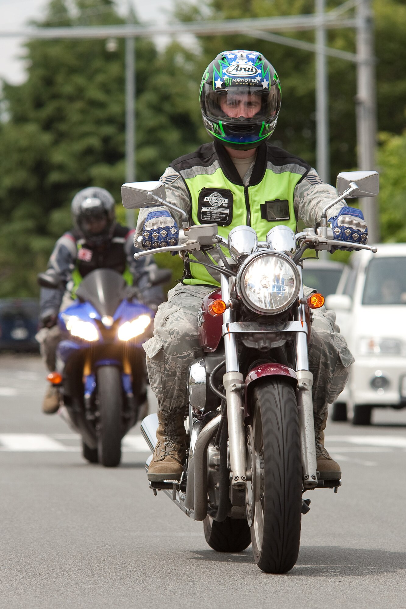 YOKOTA AIR BASE, Japan -- Tech. Sgt. Jason Scott, ground safety craftsman (front), and Tech. Sgt. Scott Roberts, flight safety noncommissioned officer (back), both from the 374th Airlift Wing Safety office, take all the necessary safety measures while driving their motorcycles at Yokota Air Base, Japan, May 31, 2011. During the Critical Days of Summer campaign, base leadership urge all Airmen to exercise safe practices and make sound judgments both on and off-duty. (U.S. Air Force photo/Osakabe Yasuo)