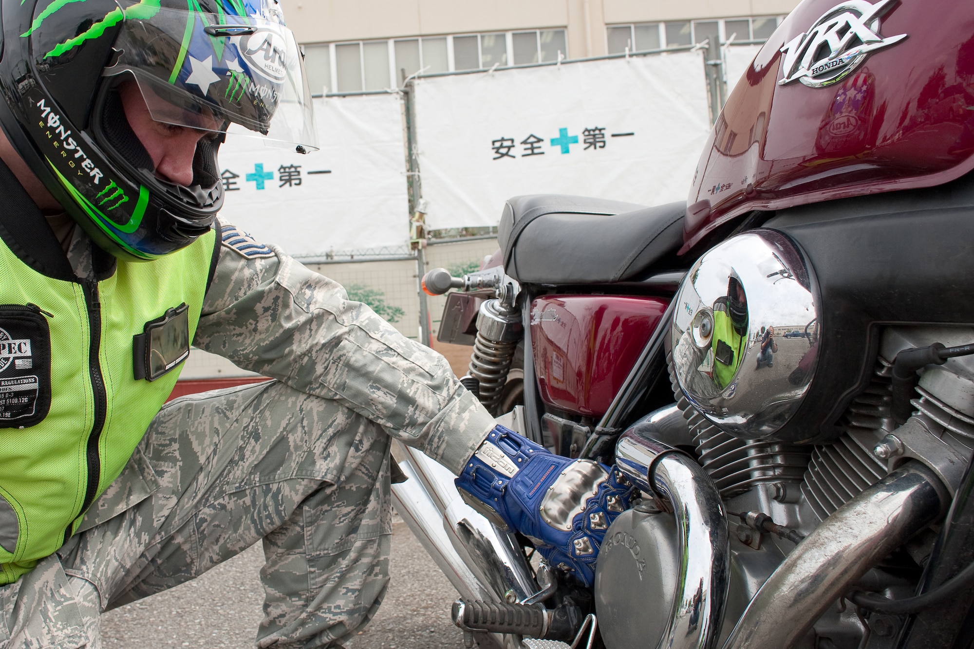 YOKOTA AIR BASE, Japan -- Tech. Sgt. Jason Scott, 374th Airlift Wing Safety ground safety craftsman, inspects his motorcycle before driving at Yokota Air Base, Japan, May 31, 2011. During the Critical Days of Summer campaign, base leadership urge all Airmen to exercise safe practices and make sound judgments on and off-duty. (U.S. Air Force photo/Osakabe Yasuo)