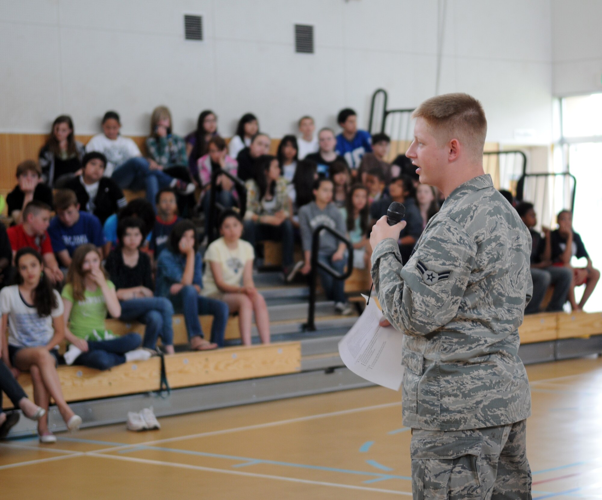 YOKOTA AIR BASE, Japan --Airman 1st Class Michael Maass, 374th Civil Engineer Squadron electrical technician, provides middle school students tips on how to conserve energy planned for the summer months, May 31, 2011, Yokota Air Base, Japan. (U.S. Air Force photo/Airman 1st Class Krystal M. Garrett) 