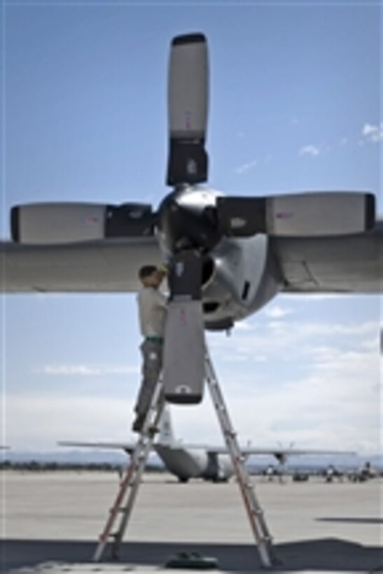 Staff Sgt. Christopher Rhodus performs an inspection on a C-130 Hercules engine during a mobility air forces exercise at the Nevada Test and Training Range on May 18, 2011.  Rhodus is a crew chief assigned to the 19th Aircraft Maintenance Squadron at Little Rock Air Force Base, Ark.  