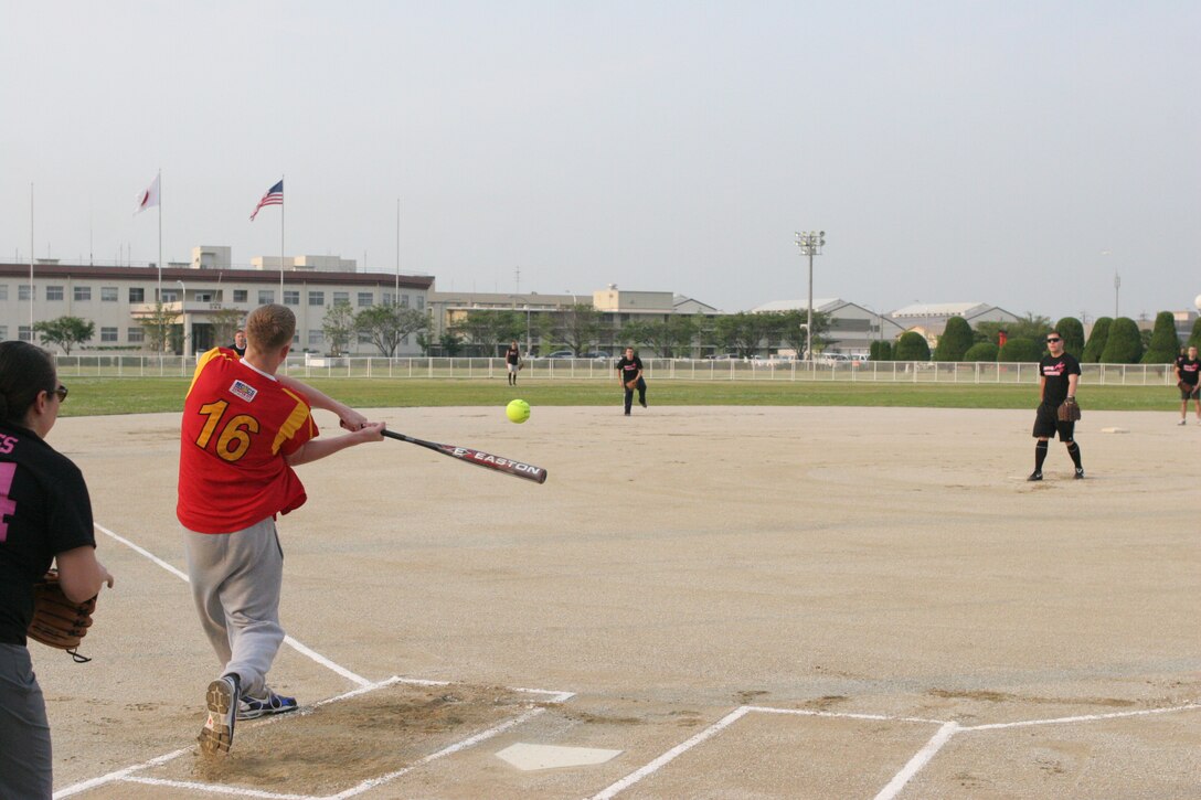 Chad A. Welsh, ATC left fielder, prepares to strike the ball  against the Devil Donkeys during an intramural softball game at the main softball field here June 2. ATC overwhelmed the Devil Donkeys 13-2. ATC capitalized on the Devil Donkeys poor field and batting, never allowing them to consistent throughout the game.