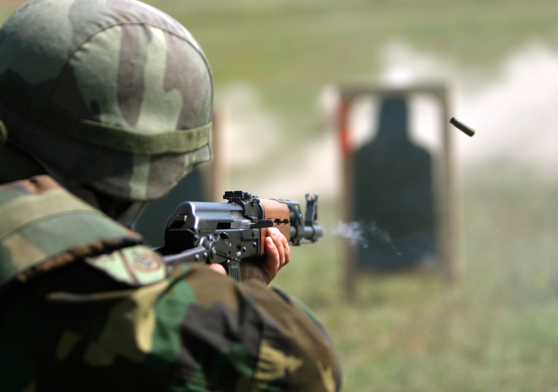 Firing a “controlled pair,” two well-aimed shots at a target, a Macedonian rifleman shoots at the range while learning Table 3 of the U.S. Marine Corps Combat Marksmanship Program lead by Marines of Black Sea Rotational Force 11. The Macedonian 1st Mechanized Infantry Brigade traveled to Babadag Training Area, Romania, to work with U.S. Marines from Black Sea Rotational Force 11 as part of their mobilization training for their upcoming deployment to Afghanistan.::r::::n::