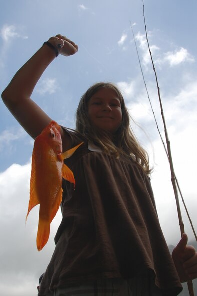 Natalie Moran shows off her caught fish at the Friends of Hickam 12th Annual Keiki Fishing Tournament at Ho'omaluhia Botanical Garden June 1. (U.S Navy Photo/Chris Aguinaldo)