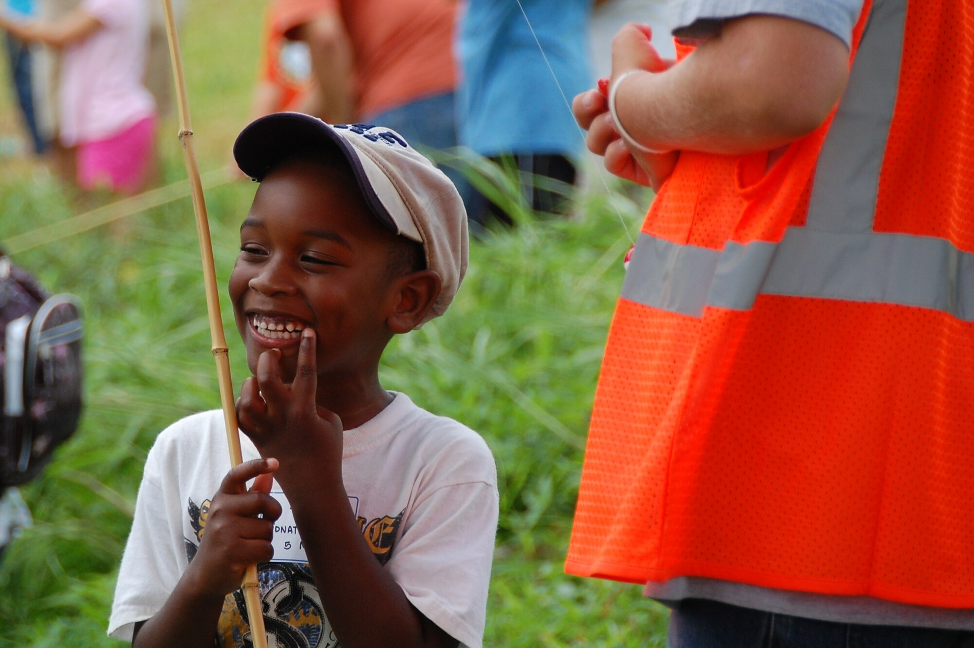 Jonathan Bell beams as a volunteer checks his catch at the Friends of Hickam 12th Annual Keiki Fishing Tournament at Ho'omaluhia Botanical Garden June 1.  (U.S Navy Photo/Chris Aguinaldo)