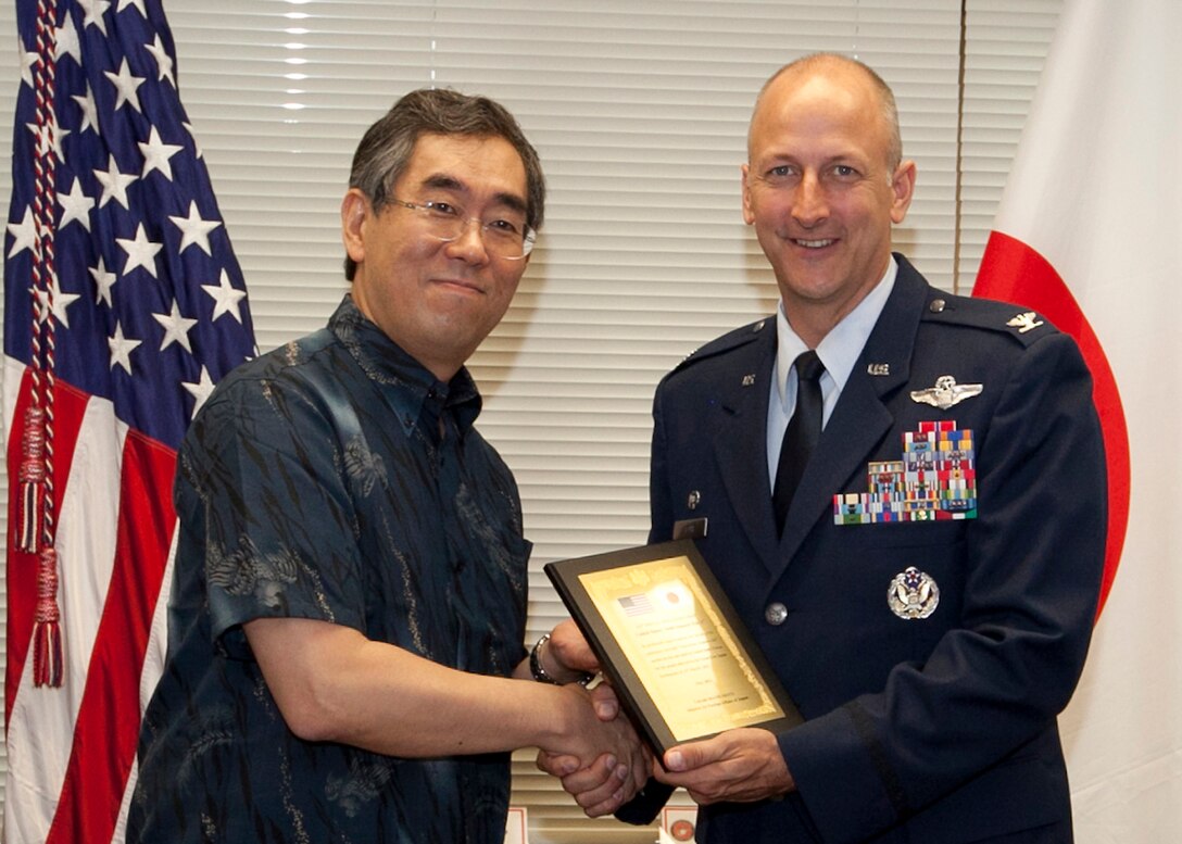 CAMP FOSTER, Japan -- Takeaki MATSUMOTO, Japan's Minister of Foreign Affairs, and Col. Robert Toth, the 353rd Special Operations Group commander, pose for a photo after Minister MATSUMOTO presented a plaque during a small ceremony that took place during a meeting with Senior U.S. leadership on Okinawa May 28. The minister presented a plaque Colonel Toth and other leaders as a small token of gratitude for the efforts during Operation Tomodachi on behalf of the Japanese people. (U.S. Marine Corps photo by Cpl. Patricia D. Lockhart)