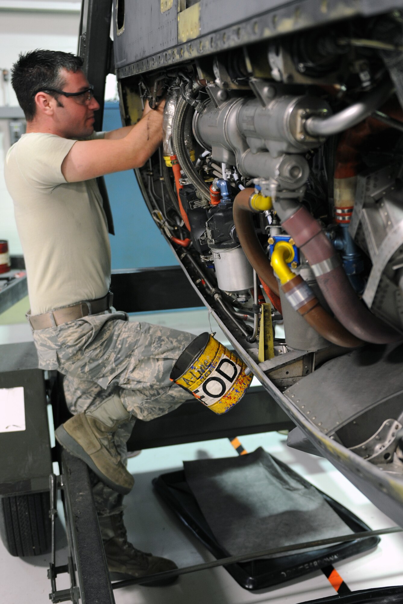 Staff Sgt. Jeffery Crosby, a 19th Component Maintenance Squadron aerospace propulsion journeyman, installs a fuel nozzle on a C-130 engine May 31, 2011, at Little Rock Air Force Base, Ark. The centralized repair facility trauma cell services at least one C-130 engine a week. (U.S. Air Force photo by Airman 1st Class Rusty Frank)