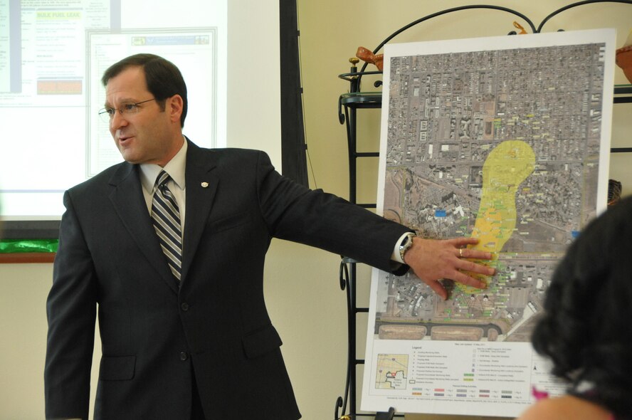 Tom Berardinelli, 377th Air Base Wing director of staff, briefs the Albuquerque International District Healthcare Coalition on Kirtland AFB-efforts to characterize and remediate the fuel plume. The coalition is made up of district volunteers, local government representatives and community health-care managers dedicated to improving the well being of residents near the base.