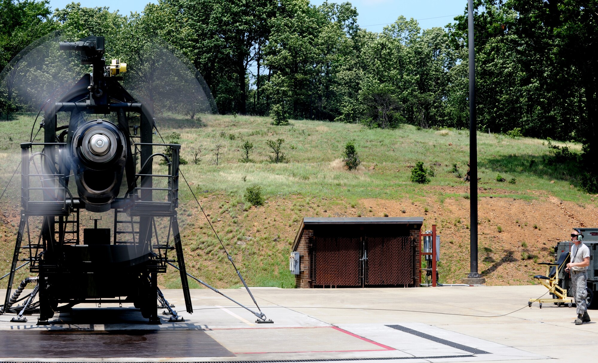 Tech. Sgt. Jeremy Leuch, 19th Component Maintenance Squadron test cell NCO-in-charge, observes a C-130 engine during a performance check May 25, 2011, at Little Rock Air Force Base, Ark. A C-130 engine performance check is a two-day process before the engine is sent back to the engine shop for final inspection. (U.S. Air Force photo by Airman 1st Class Rusty Frank)
