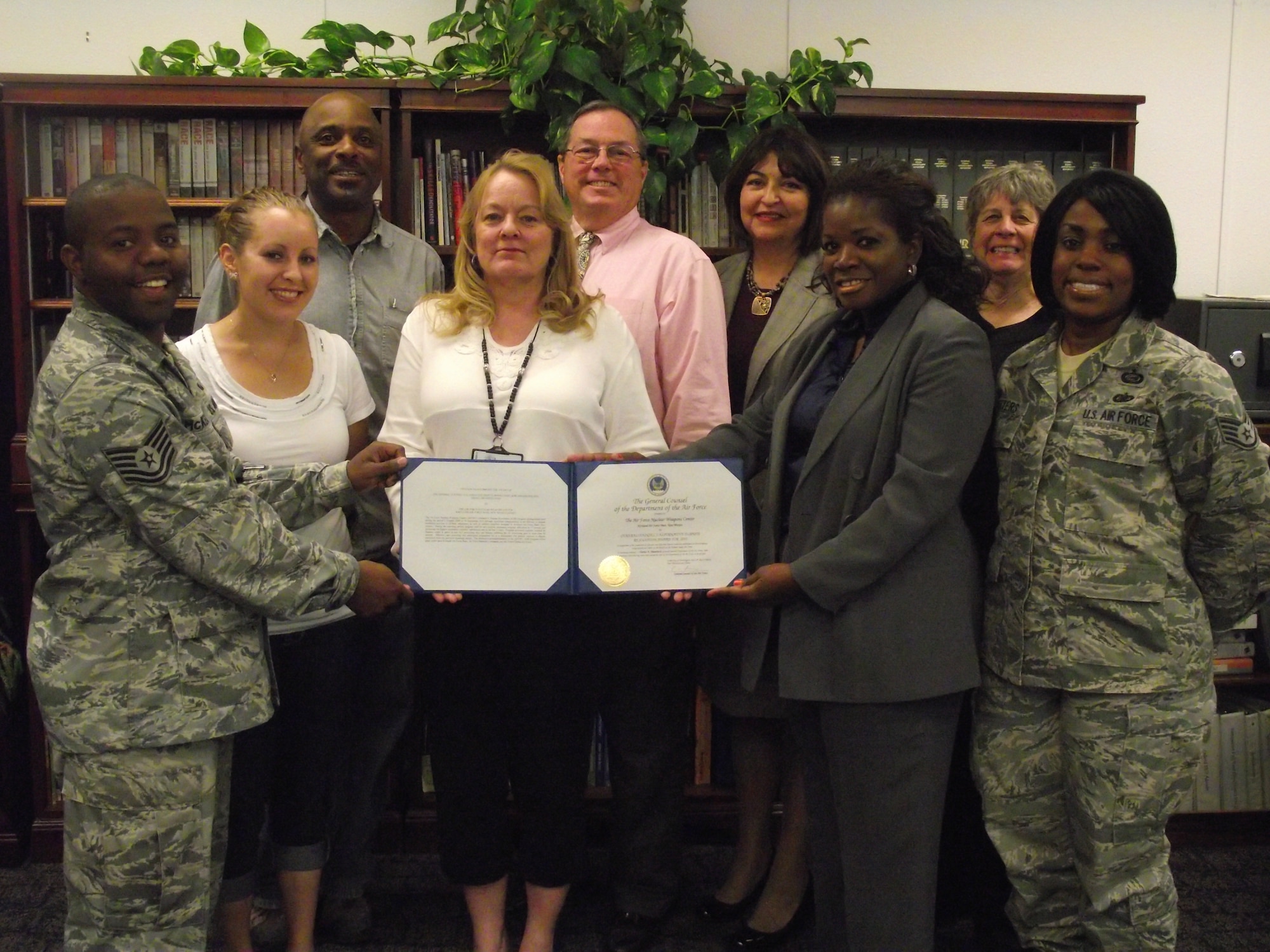 Equal Opportunity Office members include, bottom row, from left; Tech. Sgt. Cedric McKeaver, Amanda Romero, Sandra Maturo, Bonnie Chanet, Staff. Sgt. Elisha Peters. Top row, from left; Maurice Taylor, Robert Liddy, Ofelia Mejiaortega, Leslie Arana. Not pictured are Cyrus Salazar, Tech. Sgt. Davidad Holmes and Michael Sarkovitz.